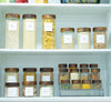 Shelving unit with labeled jars containing various food items