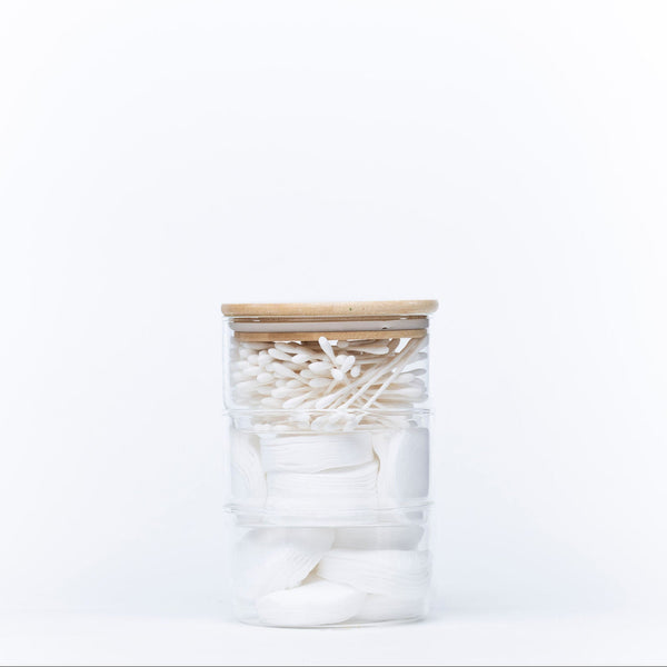 Stackable Round Bamboo Glass Jar – 450ml filled with cotton pads and swabs for bathroom storage and organisation.