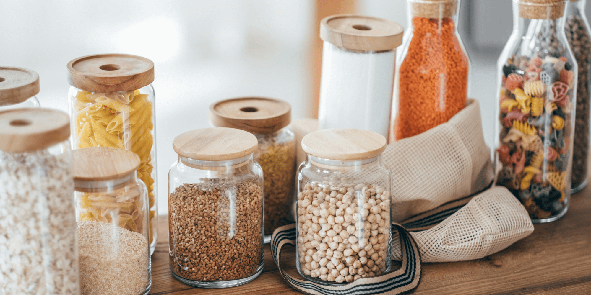 Assorted pantry storage jars with bamboo lids, perfect for home organisation and kitchen use in Australia.