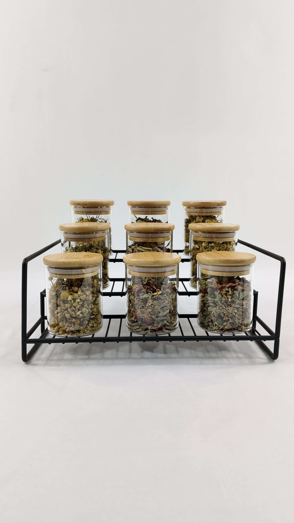 Black metal spice rack with pantry jars, ideal storage organizer for kitchen or pantry.