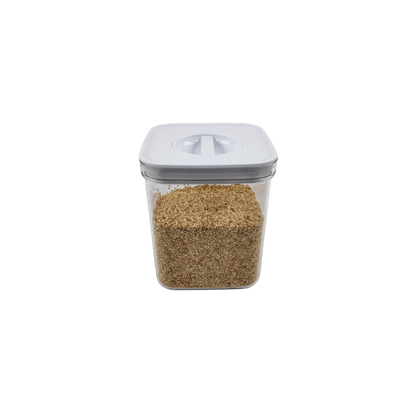 White twist canister with grains, ideal pantry storage, airtight kitchen organiser, space-saving jar.