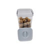 Clear plastic canister with twist lid, ideal for pantry storage, featuring nuts inside.