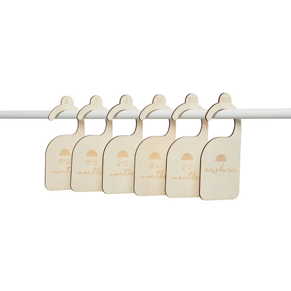 Natural plywood wardrobe dividers set for baby clothes organization, featuring size labels for efficient storage and home organization.