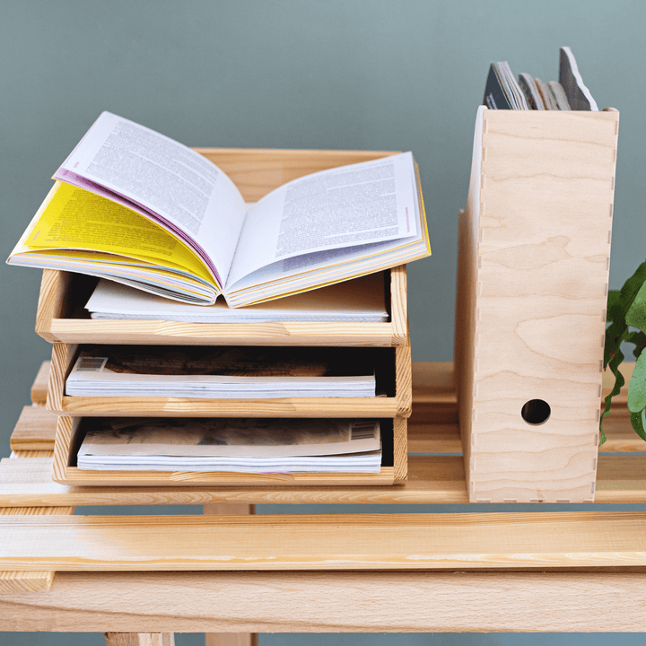 Wooden desk organiser with open book and vertical file holder for home study space.