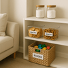 Clear pantry storage containers with snacks and blocks in a wicker basket. Home organisation