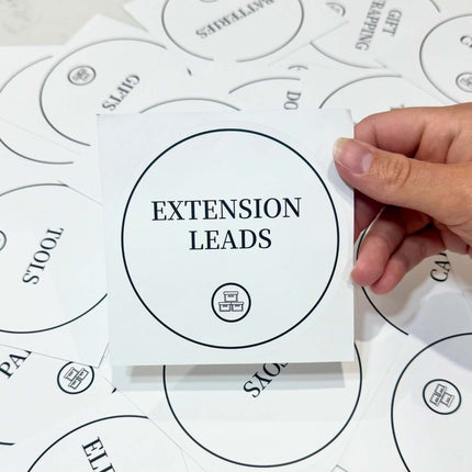 Waterproof extension leads label for organised home storage solutions.