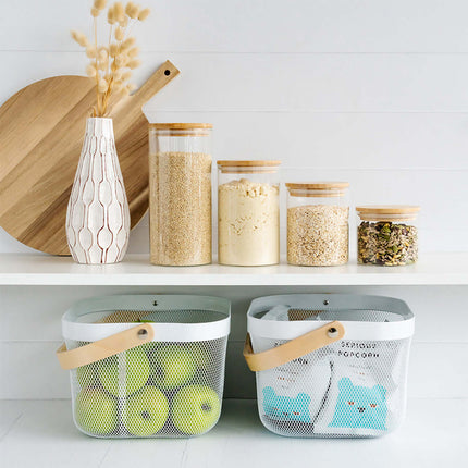 Pantry storage with glass containers and space-saving baskets for home organisation.
