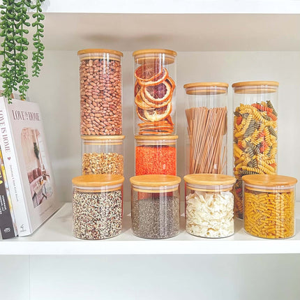 Glass jars with bamboo lids for pantry organisation and space-saving kitchen storage.