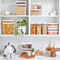 Airtight pantry jars with wooden lids for organised home storage. Perfect for kitchen essentials.