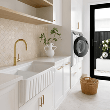 Elegant laundry room with space-saving wicker basket, promoting home organisation.
