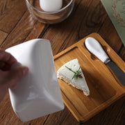 Ceramic Butter Dish with Bamboo Base used in kitchen for stylish butter storage, enhancing pantry organisation.