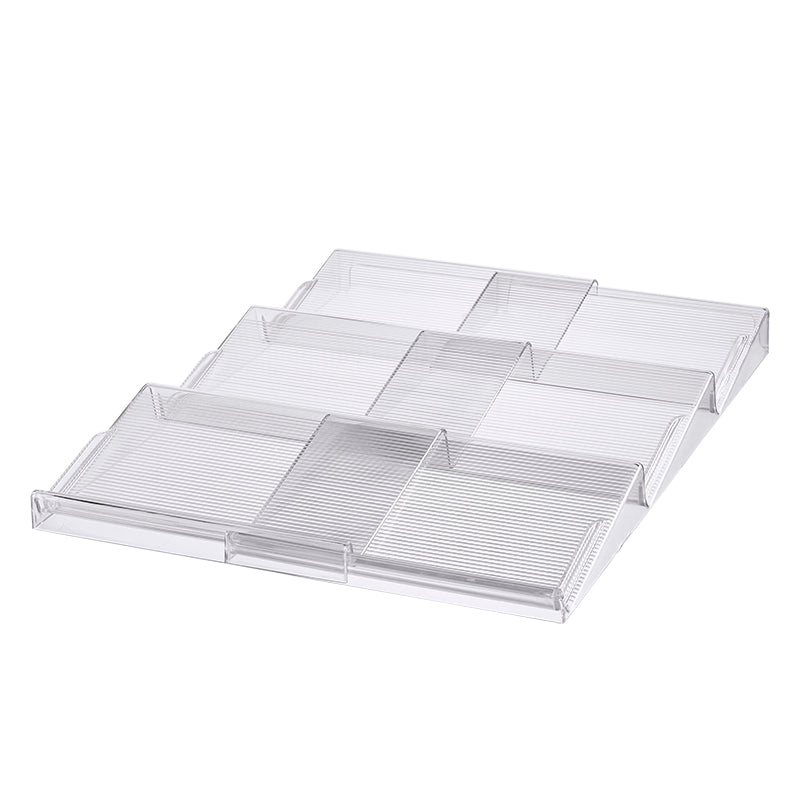Expandable In-Drawer Spice Rack made of clear plastic, ideal for kitchen and pantry organisation. Maximises drawer space efficiently.