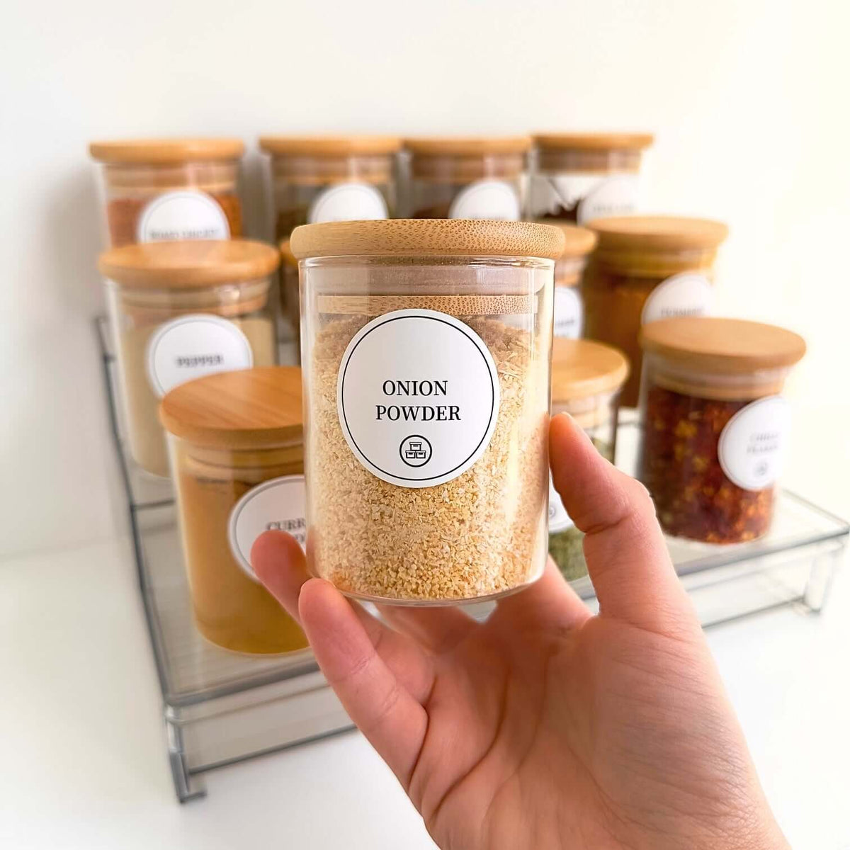Spice Rack with 12 Bamboo Jars – Acrylic Drawer Organiser for efficient kitchen or pantry storage featuring glass onion powder jar.