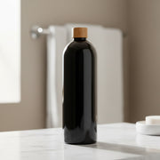 Black Screw Top Bottle – 1 L Refillable Storage for kitchen and pantry organisation, ideal for storing liquids on countertops.