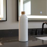 White Screw Top Bottle – 1 L Refillable Storage on bathroom counter, ideal for kitchen or pantry organisation.