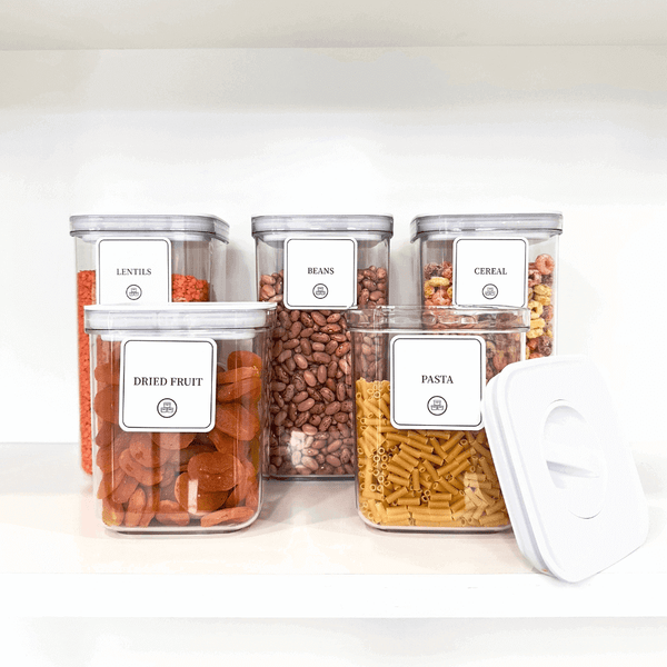 Sealed airtight containers filled with pasta, cereals, and dried goods, ideal for kitchen storage and pantry organisation.