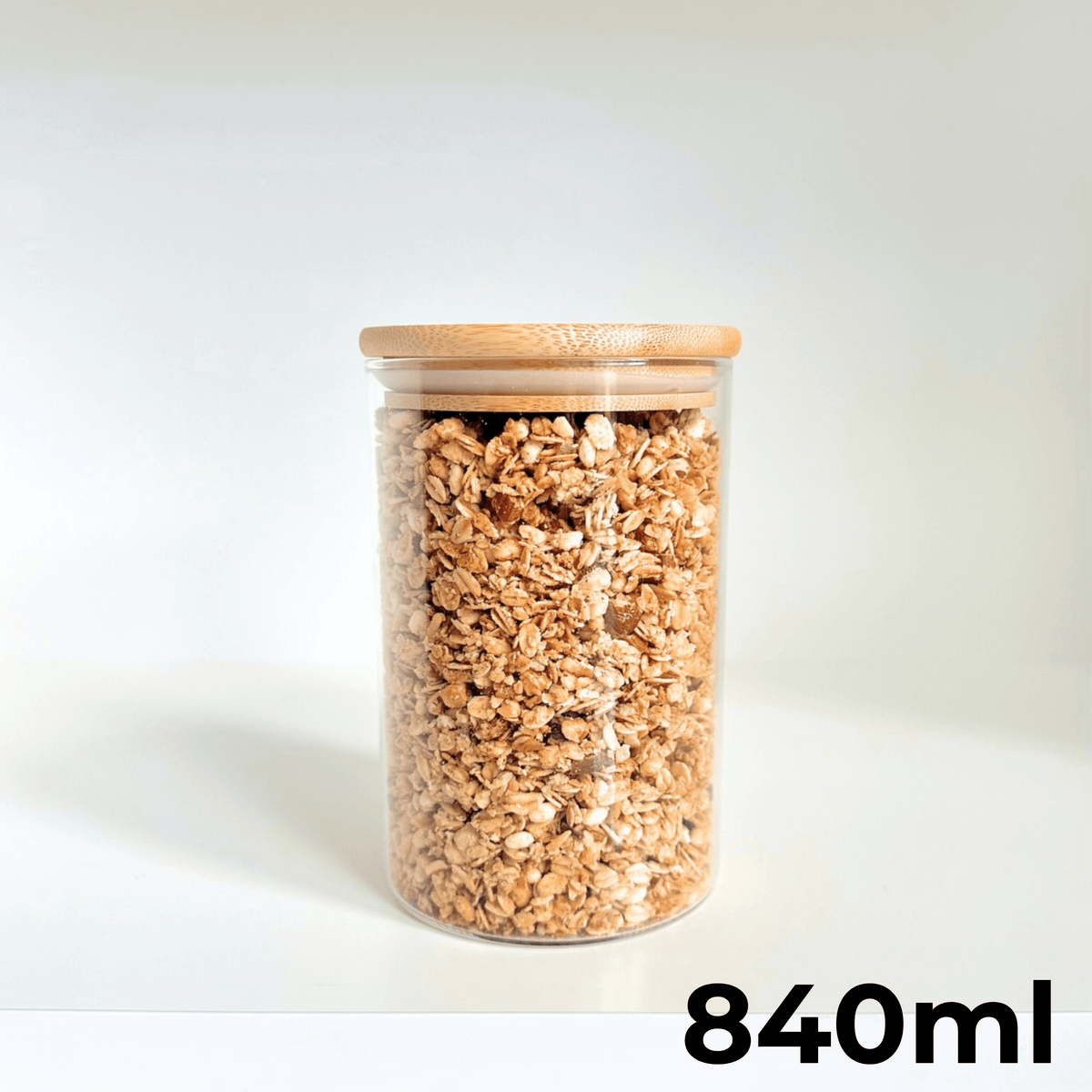 Round Bamboo Pantry Glass Jar Set – 5 Stackable Sizes, ideal for kitchen storage organisers, featuring 840ml size filled with oats.