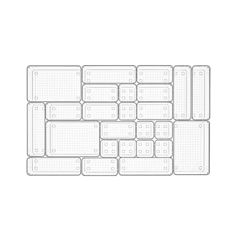 Top view of 25 clear drawer organiser trays arranged together in one drawer layout