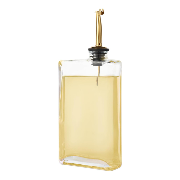 Glass oil dispenser with gold spout, ideal for kitchen storage. Stylish home organisation, part of a book-style set. 350ml capacity.
