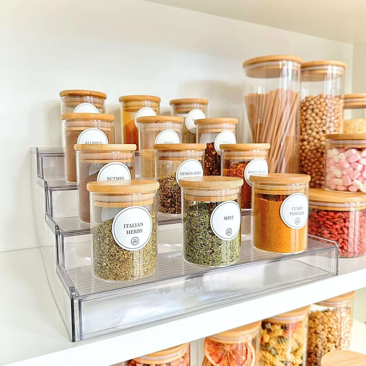 Round Glass Bamboo Herb and Spice Storage Jar Set – 12 Pack on shelf showcasing pantry organisation with glass jars in kitchen.