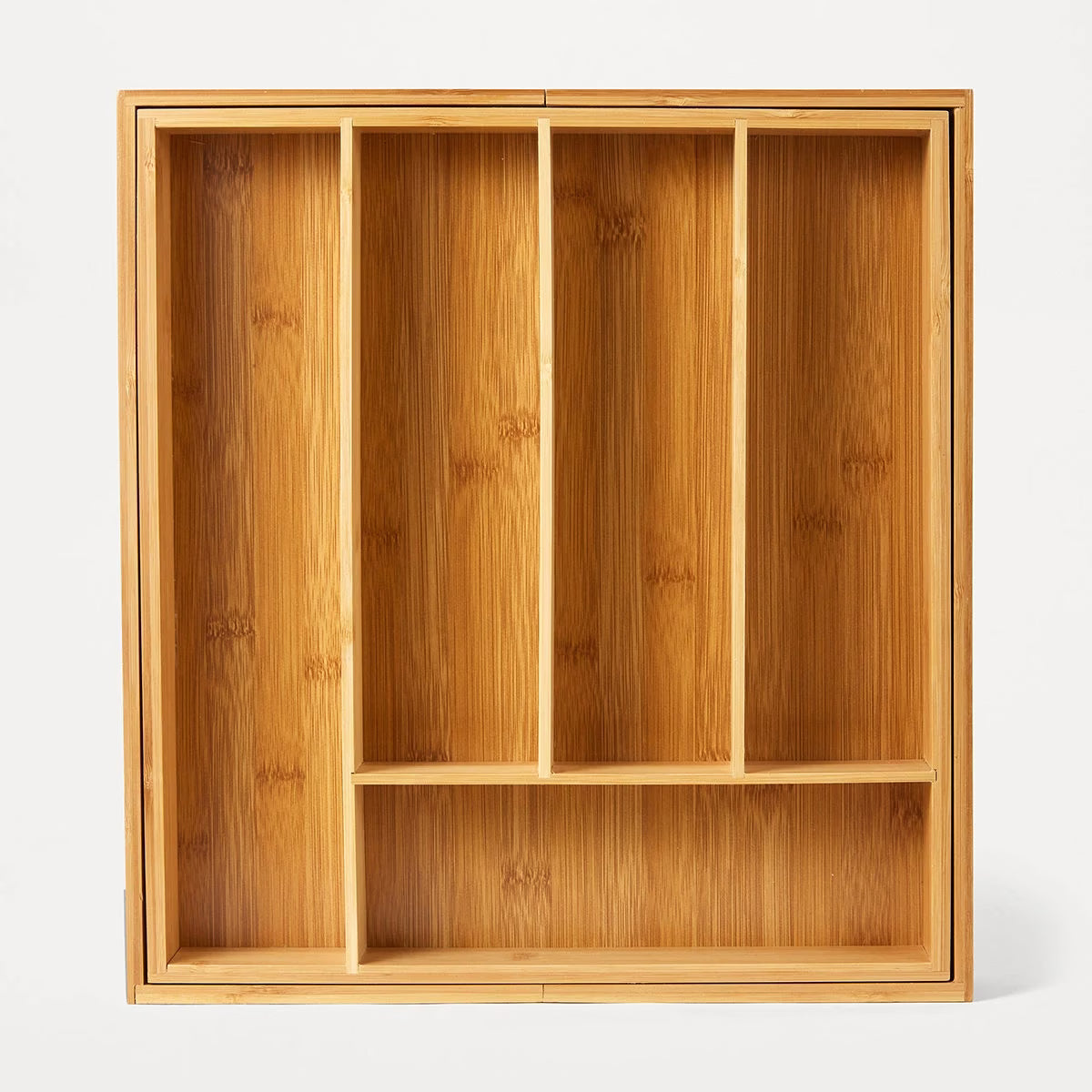 Wooden shelf with compartments on a white background