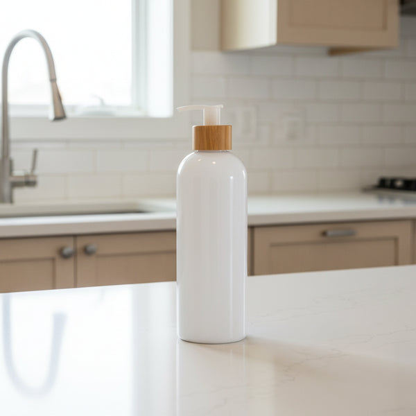 White bottle with a wooden pump on a white background