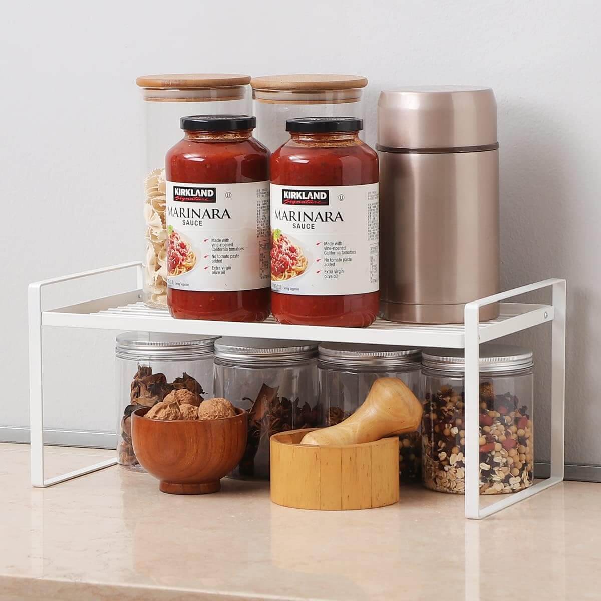 Metal Under Sink Shelf – White used for kitchen organisation with storage organisers, featuring jars and containers for efficient space use.