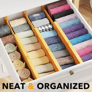 Bamboo Expandable Drawer Dividers – 4 Pack (Long) used for neat drawer organisation with socks and towels in a bedroom setting.