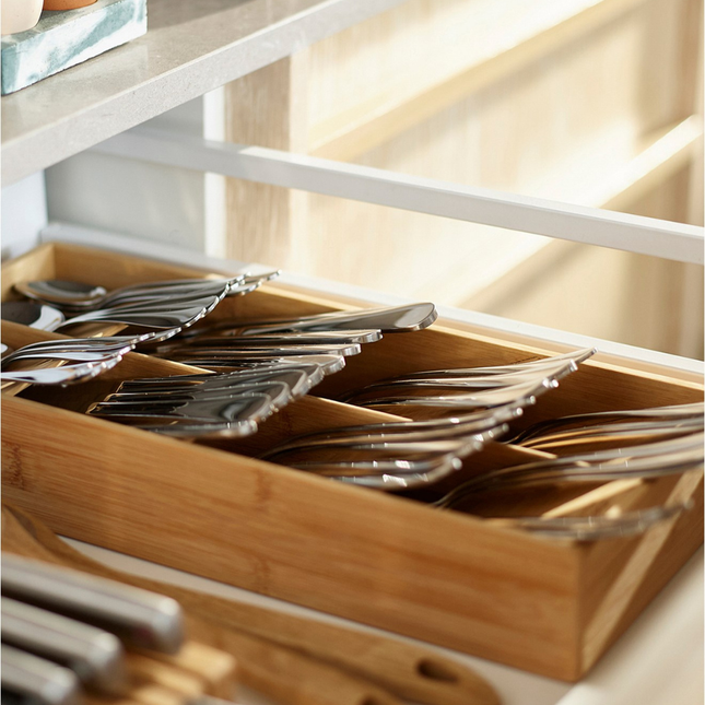 Bamboo Compact Cutlery Organiser neatly stores silverware in a kitchen drawer, enhancing kitchen organisation with eco-friendly style.