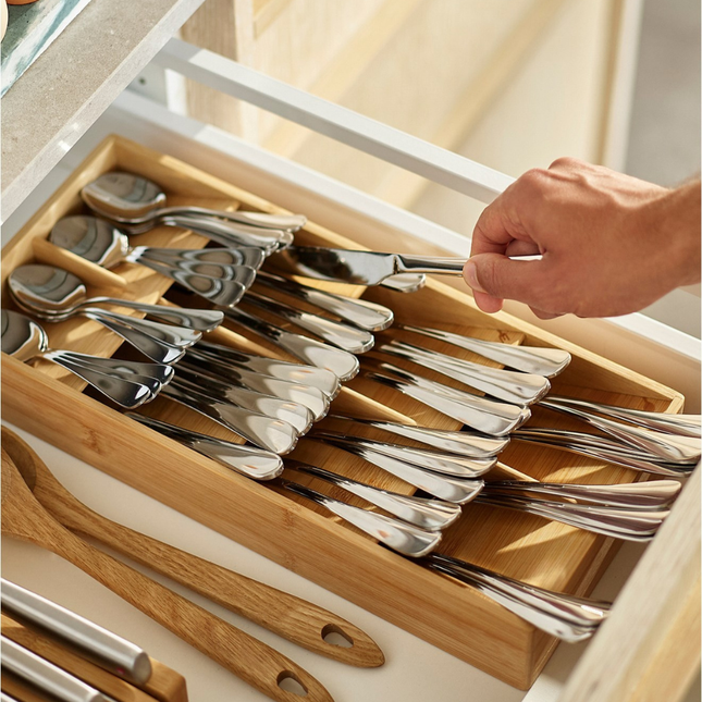 Bamboo Compact Cutlery Organiser neatly holds utensils in a kitchen drawer, enhancing kitchen organisation with stylish storage.