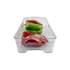 Clear storage box with peppers for organizing fridge or pantry space