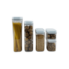 Set of white airtight containers with various pantry items for kitchen storage