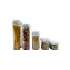 Set of white airtight containers for pantry storage with spaghetti and grains.