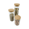 Glass storage jars with cork lids, perfect for organizing spices in the pantry or fridge.