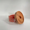 Round glass jar with acacia lid, perfect for pantry and kitchen storage.