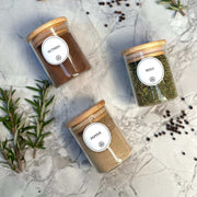 Three 120ml Herb & Spice Jars with Bamboo Lids on a marble countertop, ideal for kitchen and pantry organisation and spice storage.