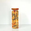 Acacia lid glass jar storing multicolored pasta for pantry or kitchen organization.