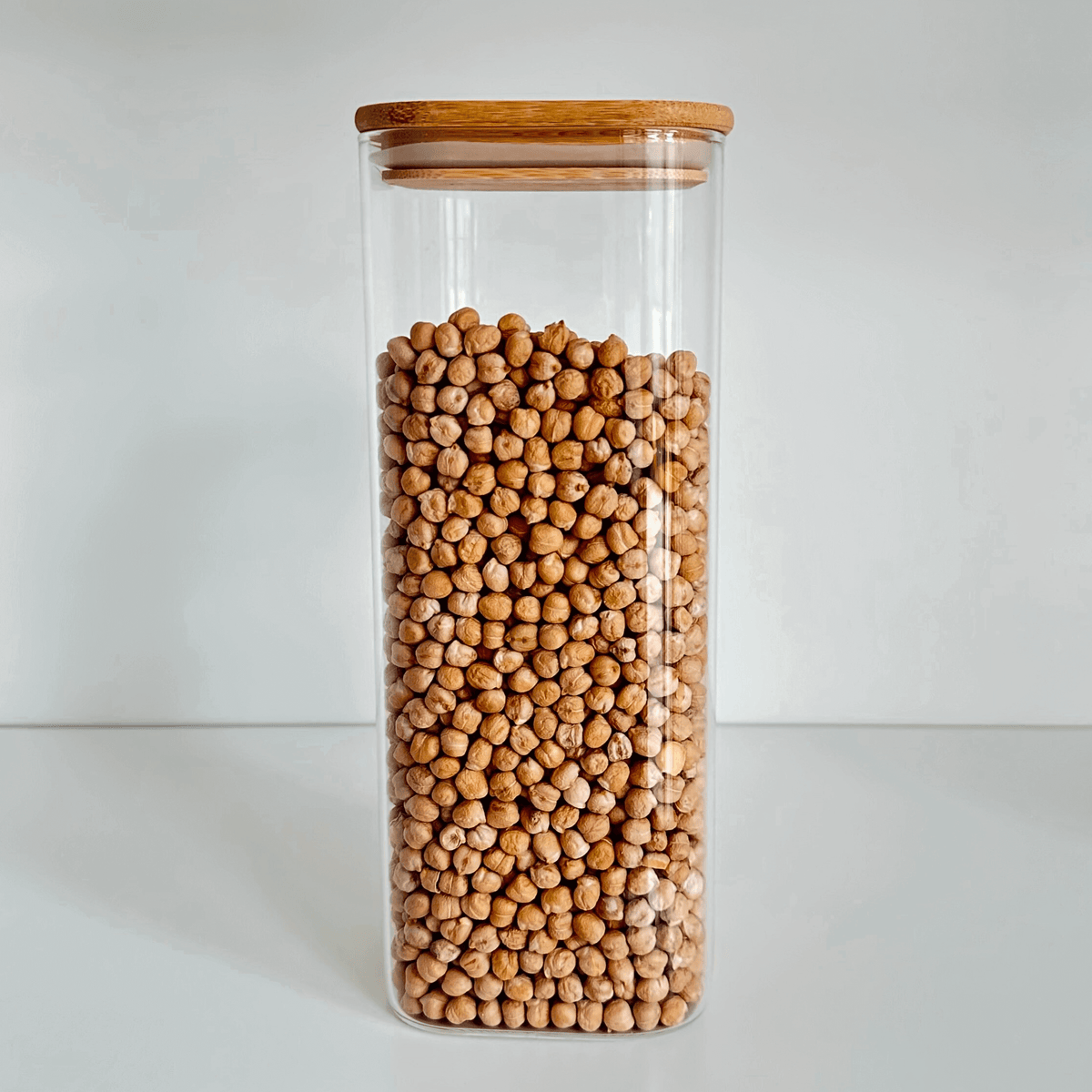 Square Bamboo Glass Pantry Jar filled with chickpeas, ideal for pantry organisation and efficient kitchen storage.