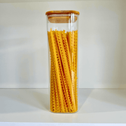 Square Bamboo Glass Pantry Jar Set – 5 Stackable Sizes used for pantry organisation, showcasing kitchen storage of pasta in a glass jar.