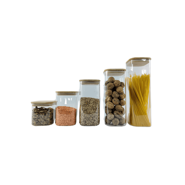 Set of five square glass storage jars with bamboo lids for pantry organization.