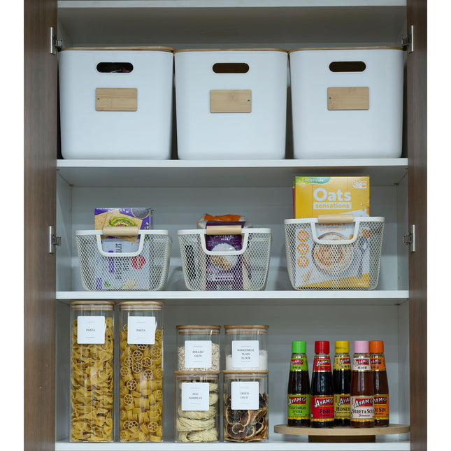Pantry organised with the New Home Set Up Pack featuring storage organisers, including baskets and glass jars for efficient kitchen use.