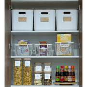 Pantry organised with the New Home Set Up Pack featuring storage organisers, including baskets and glass jars for efficient kitchen use.