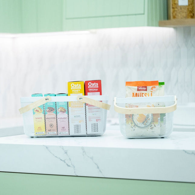 Small White Mesh Basket with Wooden Handle used as kitchen organisation for pantry items, highlighting storage organisers.
