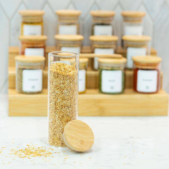 Round Glass Spice Jars with Bamboo Lid – 3 Sizes displayed on a marble countertop, perfect for kitchen and pantry organisation.