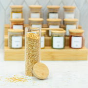 Round Glass Spice Jars with Bamboo Lid – 3 Sizes displayed on a marble countertop, perfect for kitchen and pantry organisation.