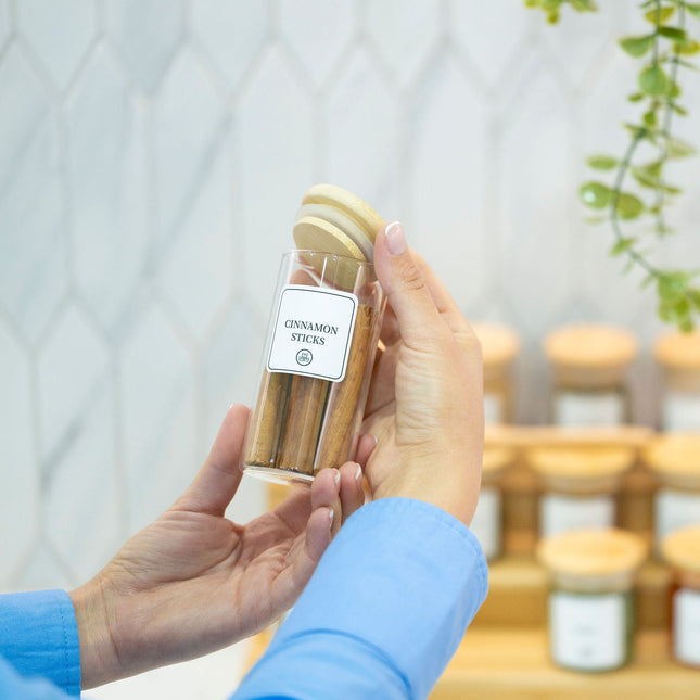 Hand holding a 160ml Herb & Spice Jar with Bamboo Lid, ideal for kitchen or pantry organisation, enhancing storage organisers.