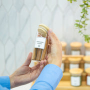 Hand holding a 160ml Herb & Spice Jar with Bamboo Lid, ideal for kitchen or pantry organisation, enhancing storage organisers.