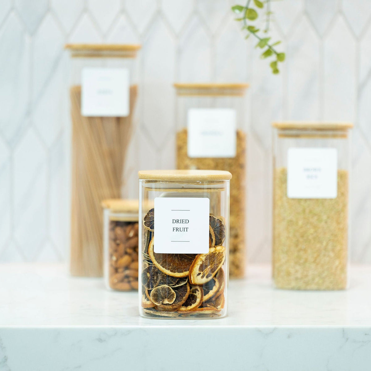 Square Glass Jar with Bamboo Lid – 1100ml Pantry Storage on kitchen countertop for pantry organisation with dried fruit, pasta, and grains.