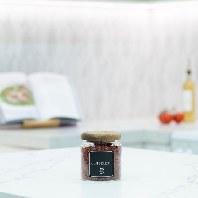 600ml Acacia Glass Jar – Airtight Kitchen Storage Solution filled with goji berries on a kitchen countertop for pantry organisation.