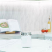 Glass Storage Jar – 750ml with Clear Stainless Lid on marble countertop, ideal for kitchen organisation and pantry storage.